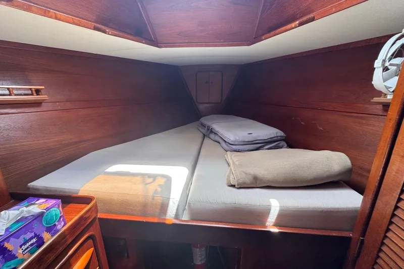 Slide: The Image of Cozy cabin interior of 1981 Gulfstar 44 Mk II Center Cockpit Sloop with wooden finish. - 56