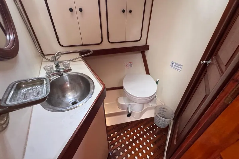 Slide: The Image of 1981 Gulfstar 44 Mk II Center Cockpit Sloop bathroom with sink and toilet. - 57