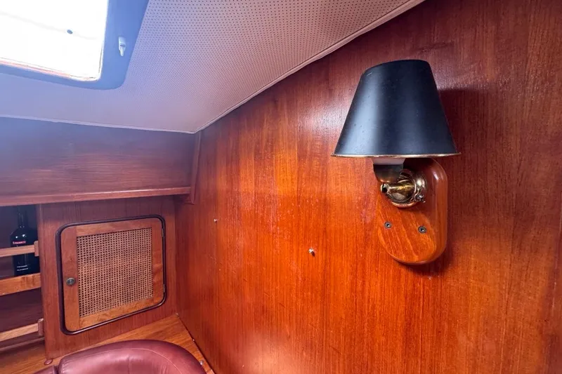 Slide: The Image of Interior of 1981 Gulfstar 44 Mk II Sloop with wooden paneling and wall-mounted lamp. - 59