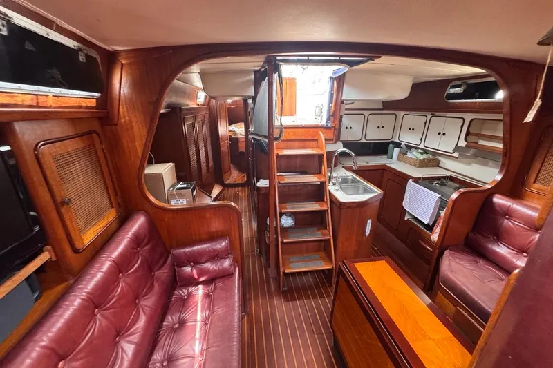 Slide: The Image of Interior of 1981 Gulfstar 44 Mk II Center Cockpit Sloop with wood finish and leather seating. - 61