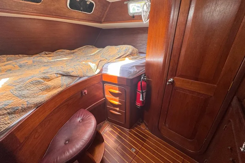 Slide: The Image of Cozy cabin interior of 1981 Gulfstar 44 Mk II Center Cockpit Sloop with wood finish. - 65
