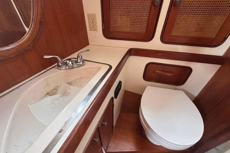 Slide: The Image of 1981 Gulfstar 44 Mk II Center Cockpit Sloop bathroom with sink and toilet. - 66