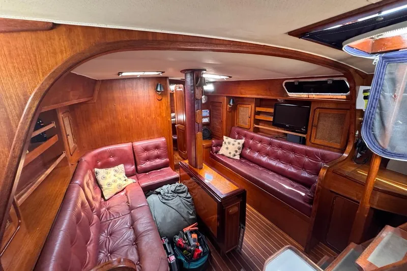 Slide: The Image of Interior of 1981 Gulfstar 44 Mk II Sloop with wood paneling and leather seating. - 76