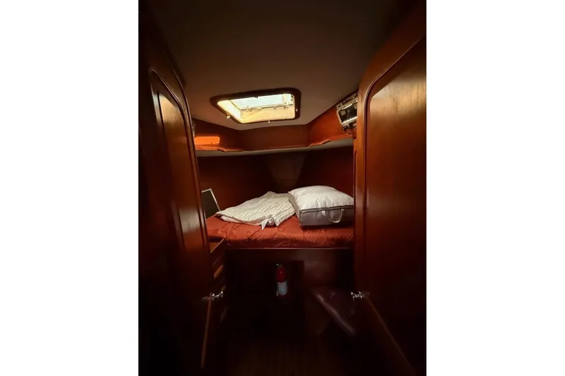Slide: The Image of Cozy cabin interior of 1981 Gulfstar 44 Mk II Center Cockpit Sloop with wooden finish. - 11