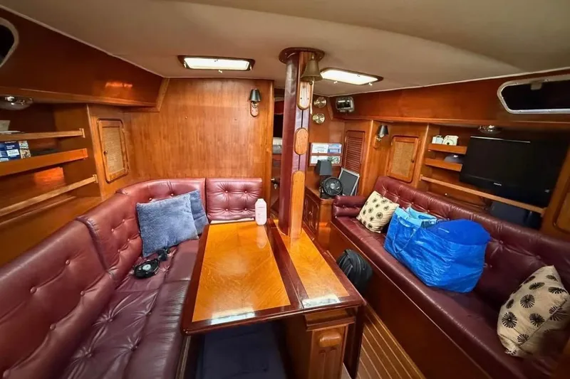 Slide: The Image of Interior of 1981 Gulfstar 44 Mk II Sloop with wood paneling and leather seating. - 7