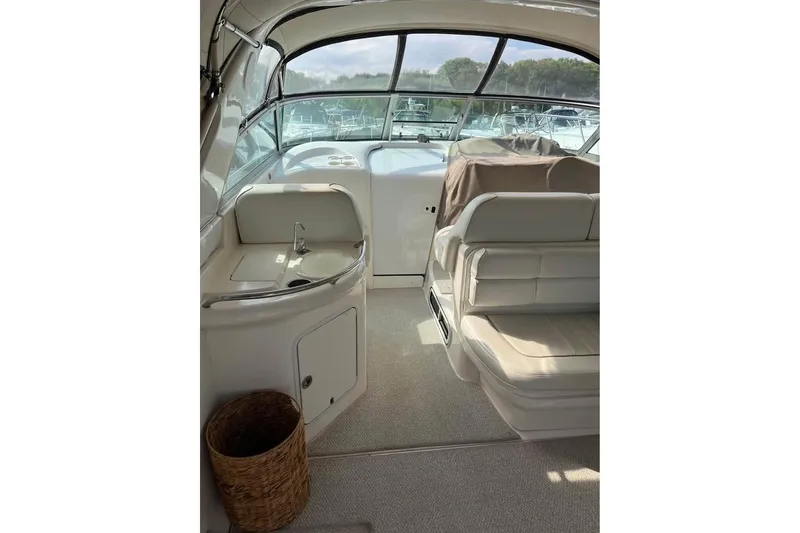 Slide: The Image of Interior of a 1997 Sea Ray Sundancer 330 yacht with seating and a small sink area. - 5
