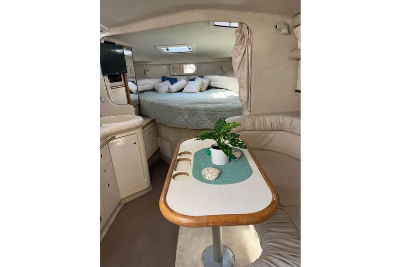 Slide: The Image of Interior of 1997 Sea Ray Sundancer 330 yacht with cozy seating and elegant decor. - 7
