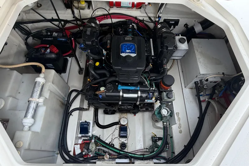 Slide: The Image of Engine compartment of a 2008 Sea Ray 270 Amberjack, showcasing the MerCruiser engine. - 25