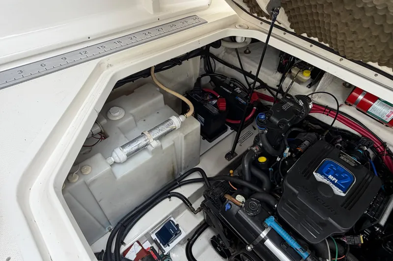 Slide: The Image of Engine compartment of a 2008 Sea Ray 270 Amberjack, featuring a Mercury 6.2 MPI engine. - 26