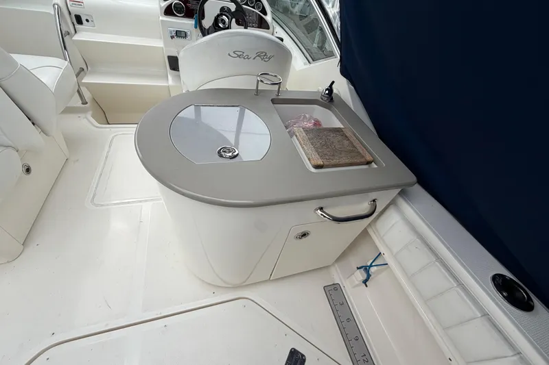 Slide: The Image of 2008 Sea Ray 270 Amberjack boat interior with sink and cutting board. - 9