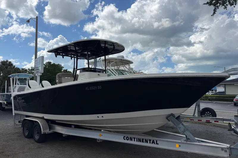 The Image of 2020 Sea Chaser 27 HFC CC boat on trailer under cloudy sky. - 0