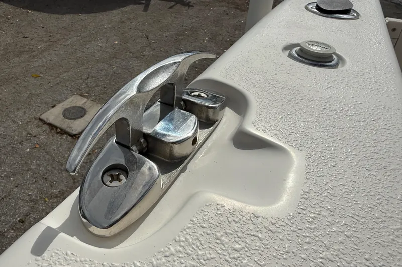 Slide: The Image of Close-up of a 2020 Sea Chaser 27 HFC CC boat cleat on textured deck. - 11