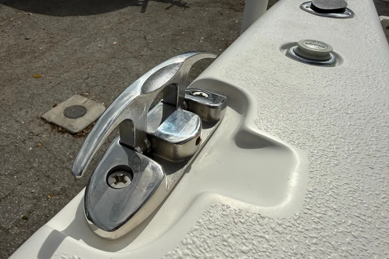 Slide: The Image of Close-up of a 2020 Sea Chaser 27 HFC CC boat cleat on textured deck. - 12