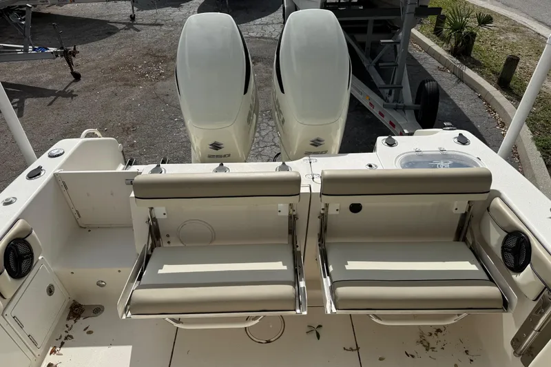 Slide: The Image of 2020 Sea Chaser 27 HFC CC boat with dual outboard engines and seating area. - 15