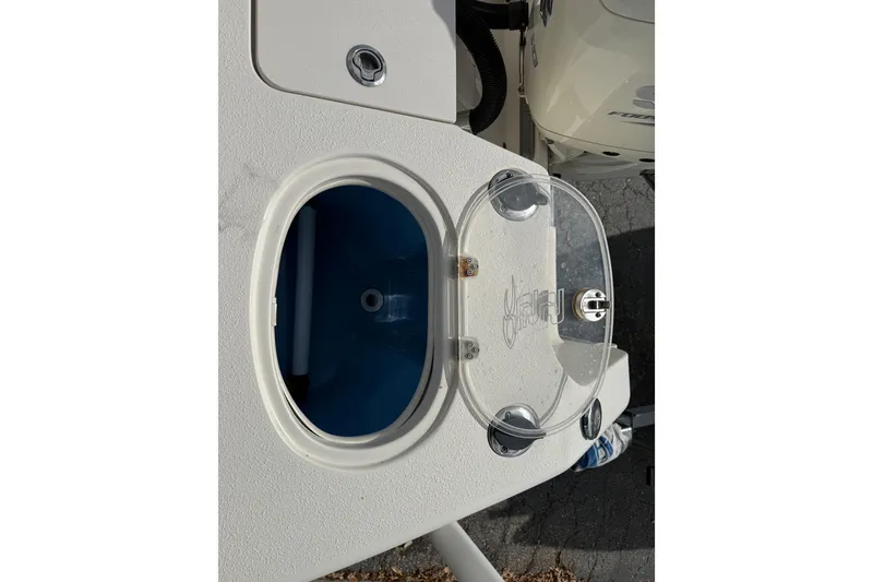 Slide: The Image of Livewell compartment on a 2020 Sea Chaser 27 HFC CC boat, featuring a clear lid. - 19
