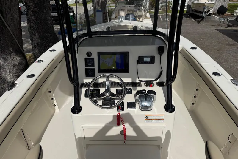 Slide: The Image of 2020 Sea Chaser 27 HFC CC boat console with steering wheel and navigation system. - 23