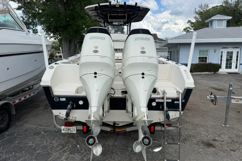 Slide: The Image of 2020 Sea Chaser 27 HFC CC boat with dual 250 horsepower engines, parked outdoors. - 3