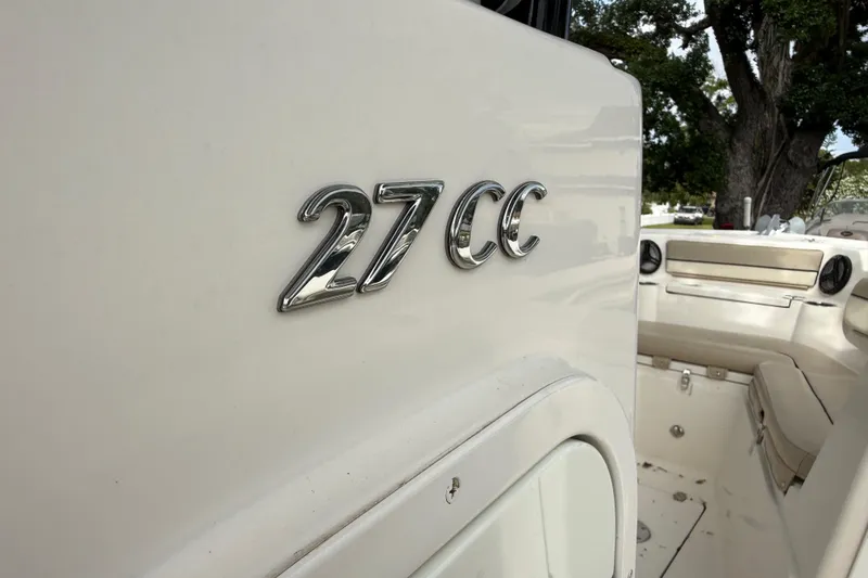 Slide: The Image of 2020 Sea Chaser 27 HFC CC boat interior with "27 CC" emblem. - 33