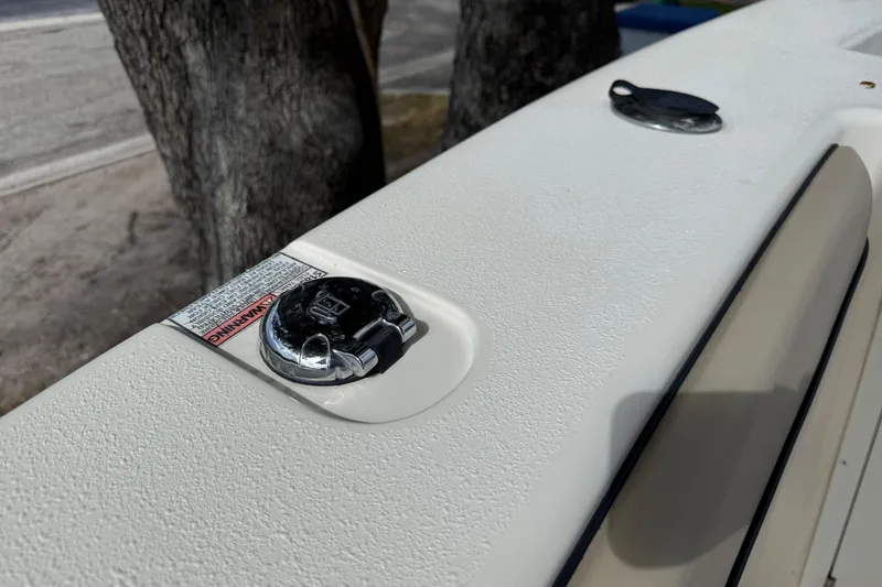 Slide: The Image of 2020 Sea Chaser 27 HFC CC boat deck with chrome fittings and warning label. - 35