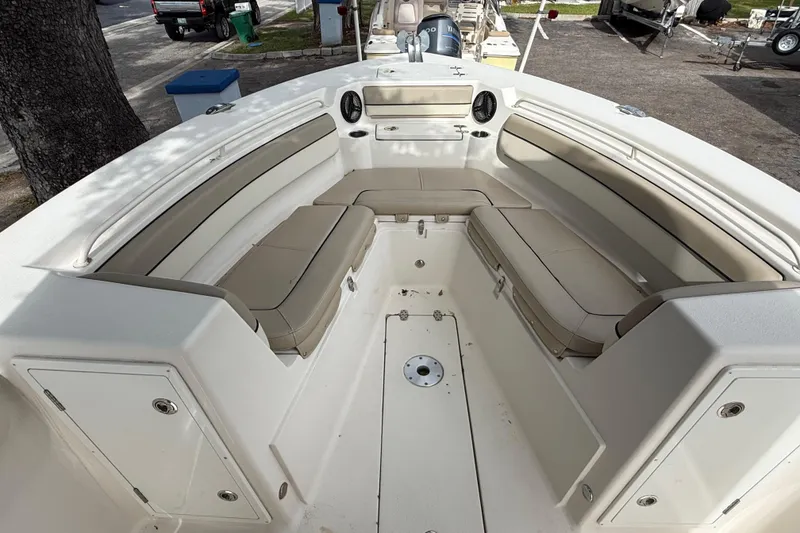 Slide: The Image of 2020 Sea Chaser 27 HFC CC boat interior with beige seating and storage compartments. - 36