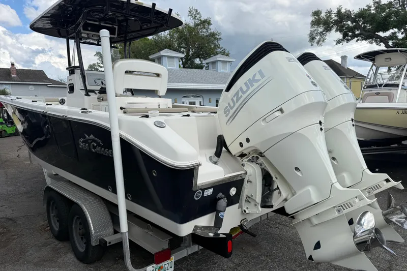Slide: The Image of 2020 Sea Chaser 27 HFC CC boat with dual Suzuki outboard motors on trailer. - 4
