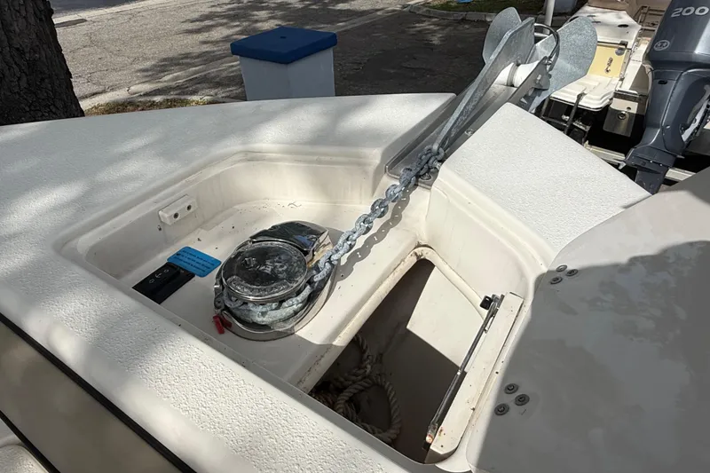 Slide: The Image of 2020 Sea Chaser 27 HFC CC anchor compartment with chain and winch. - 42