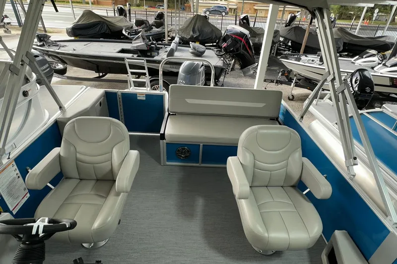 Slide: The Image of Interior of 2026 Sweetwater EX2086SFLX boat with plush seating and modern design. - 14