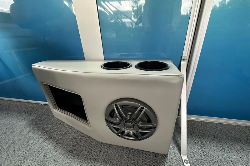 Slide: The Image of Sweetwater EX2086SFLX 2026 boat interior with cup holders and speaker. - 15