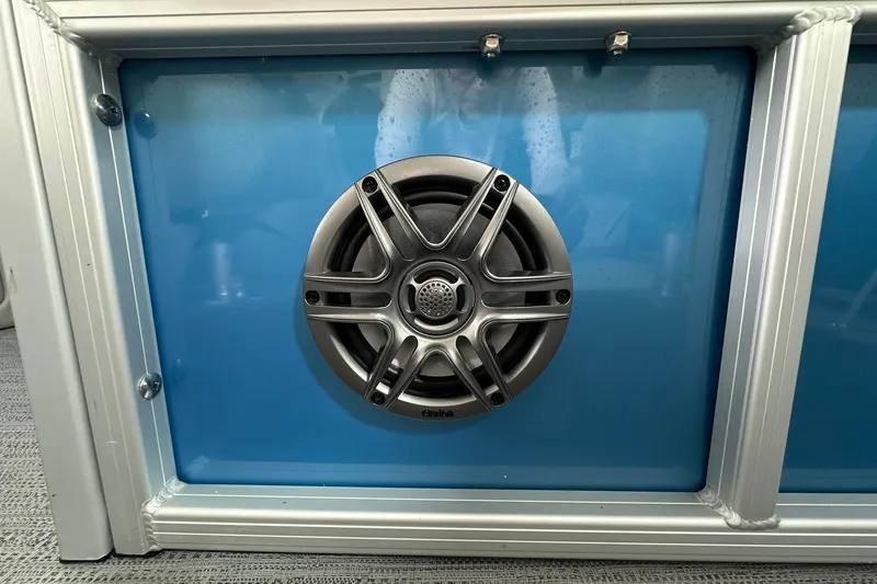 Slide: The Image of Speaker mounted on blue panel of 2026 Sweetwater EX2086SFLX. - 18