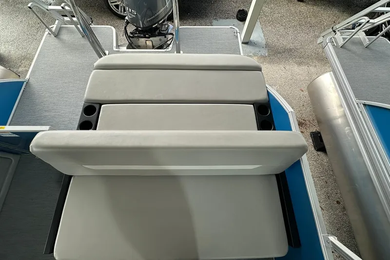 Slide: The Image of 2026 Sweetwater EX2086SFLX boat with cushioned seating and cup holders, viewed from above. - 19