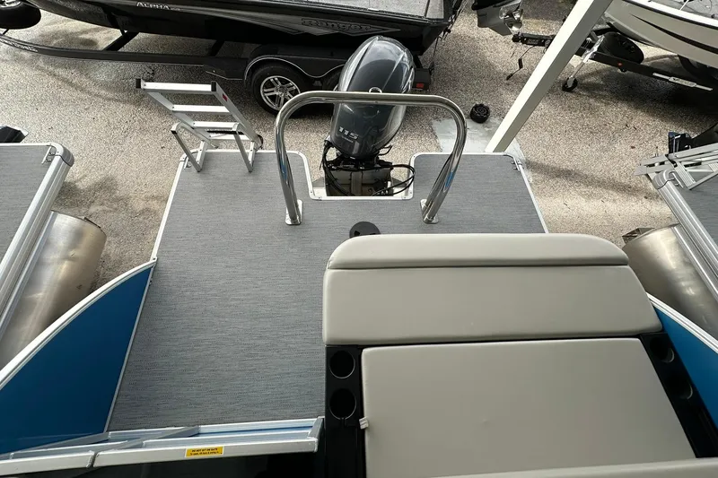 Slide: The Image of 2026 Sweetwater EX2086SFLX boat with motor and swim platform. - 21