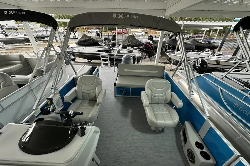 Slide: The Image of 2026 Sweetwater EX2086SFLX pontoon boat interior with seating and helm. - 6
