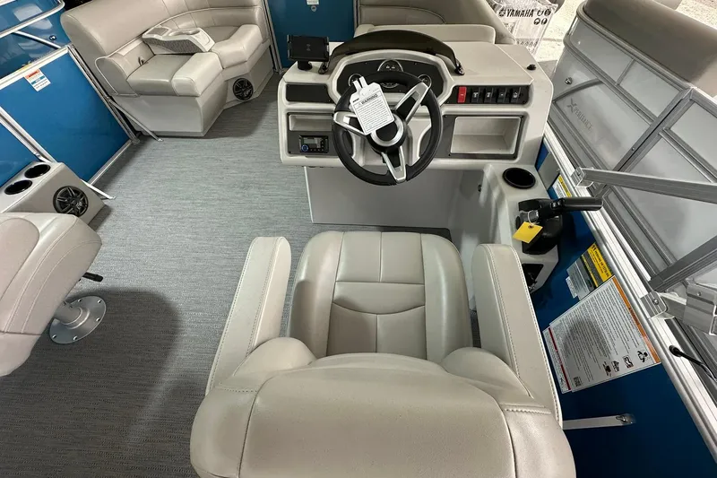 Slide: The Image of Interior of 2026 Sweetwater EX2086SFLX boat with modern steering console and seating. - 8