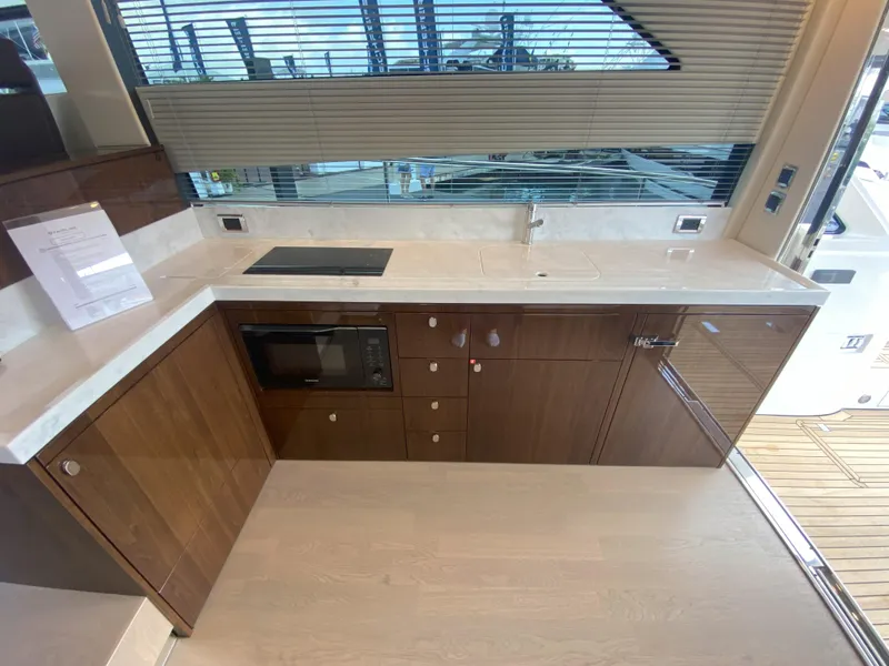 Slide: The Image of Modern kitchen on the 2024 Fairline Squadron 50 yacht. - 12