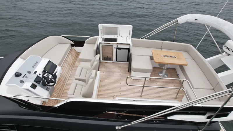 Slide: The Image of 2024 Fairline Squadron 50 yacht with spacious deck and modern amenities. - 24