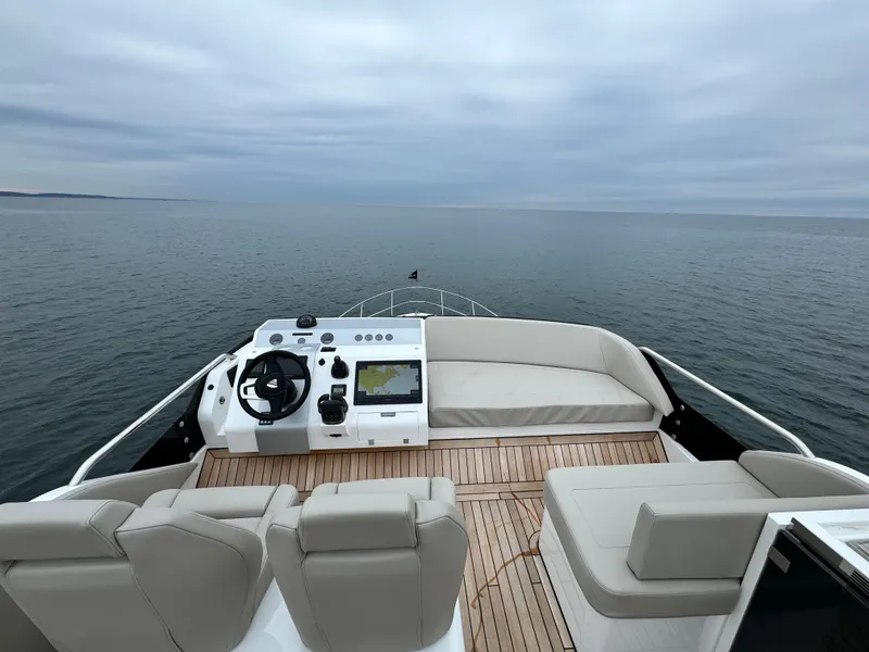 Slide: The Image of Fairline Squadron 50 2024 yacht with modern cockpit on open sea. - 27