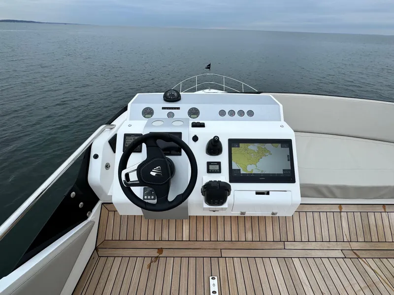Slide: The Image of Helm of Fairline Squadron 50 yacht, 2024 model, on open sea. - 28