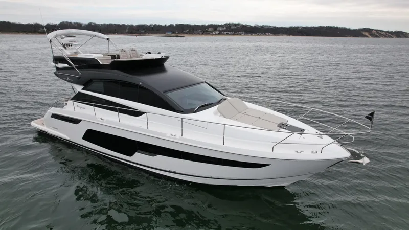 Slide: The Image of 2024 Fairline Squadron 50 luxury yacht on open water. - 3