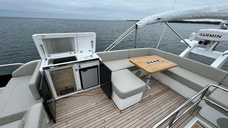 Slide: The Image of Fairline Squadron 50 Yacht 2024 with deck lounge and sea view. - 30