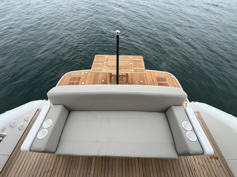 Slide: The Image of Fairline Squadron 50 2024, luxurious deck with seating area by the water. - 33