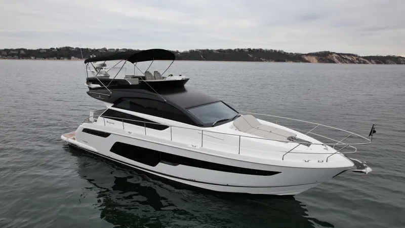 Slide: The Image of 2024 Fairline Squadron 50 yacht on calm waters. - 35