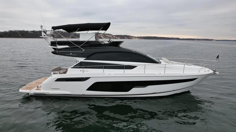 Slide: The Image of 2024 Fairline Squadron 50 luxury yacht on open water. - 36