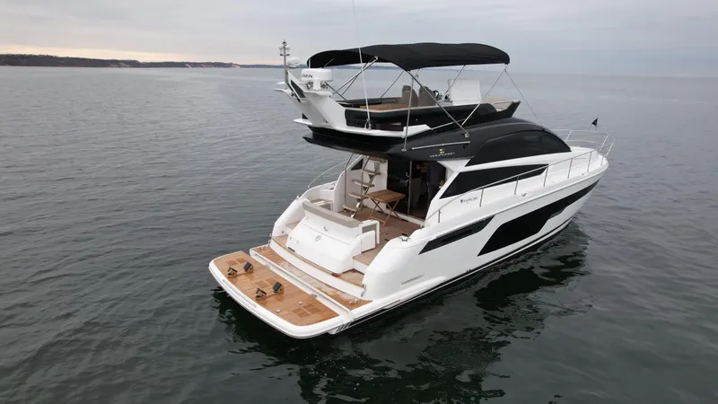 Slide: The Image of Fairline Squadron 50 Yacht 2024 on calm waters. - 37