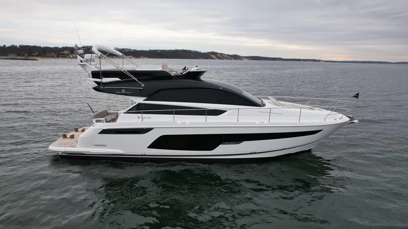 Slide: The Image of 2024 Fairline Squadron 50 luxury yacht on open water. - 4