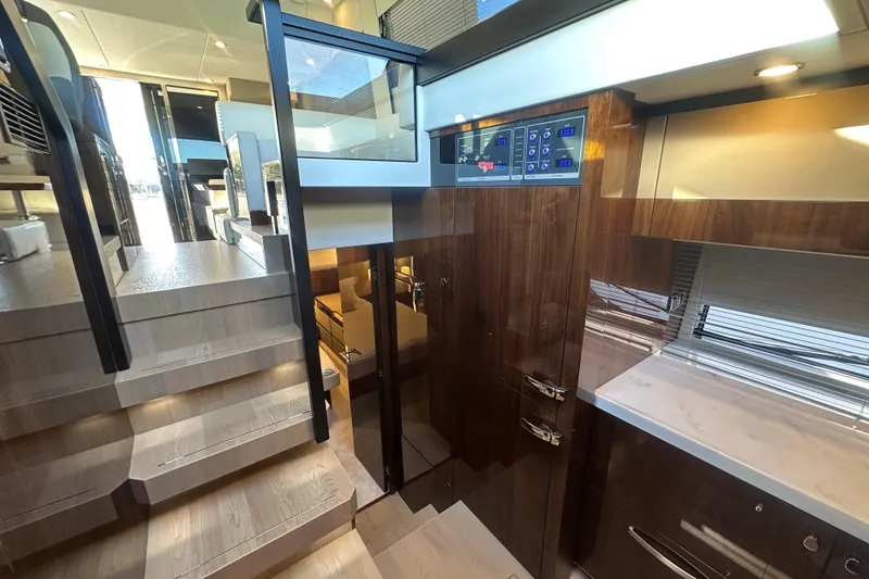 Slide: The Image of Luxurious interior of 2024 Fairline Squadron 50 yacht with modern design and wooden finishes. - 40