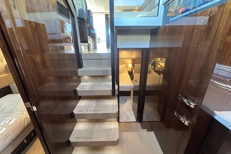 Slide: The Image of Luxurious interior of 2024 Fairline Squadron 50 yacht with elegant wooden staircase and modern design. - 41
