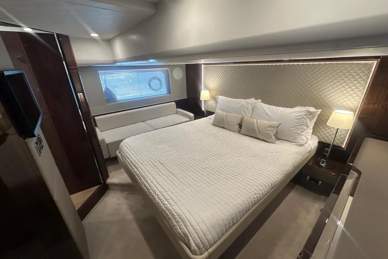 Slide: The Image of Luxurious bedroom interior of 2024 Fairline Squadron 50 yacht with elegant lighting and modern design. - 43