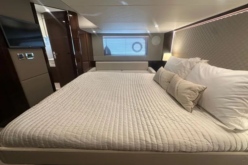 Slide: The Image of Luxurious bedroom interior of 2024 Fairline Squadron 50 yacht, featuring elegant bedding and modern design. - 44