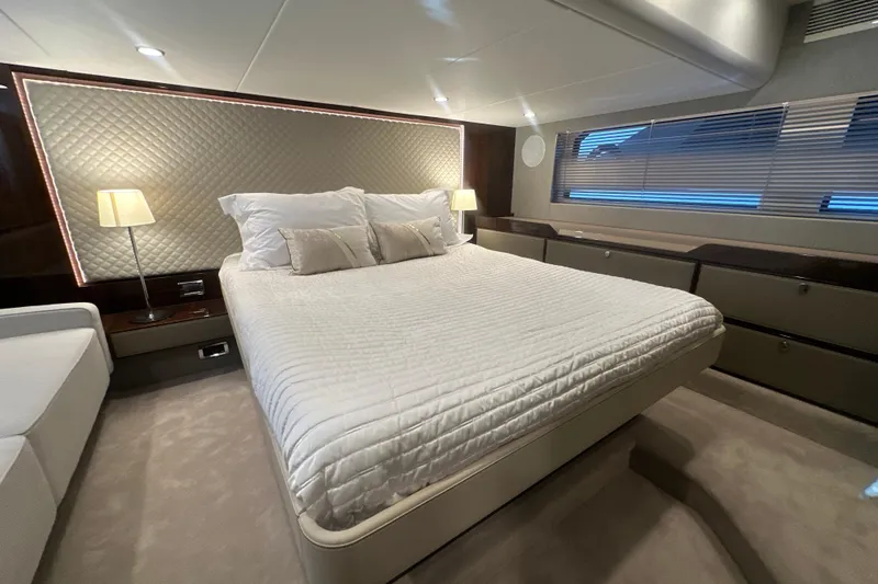 Slide: The Image of Luxurious bedroom interior of 2024 Fairline Squadron 50 yacht with elegant bedding and ambient lighting. - 45