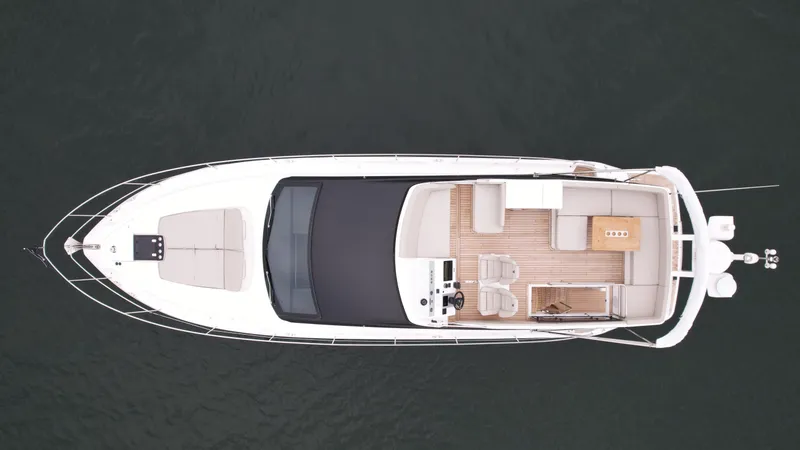 Slide: The Image of Top view of 2024 Fairline Squadron 50 luxury yacht on water. - 5